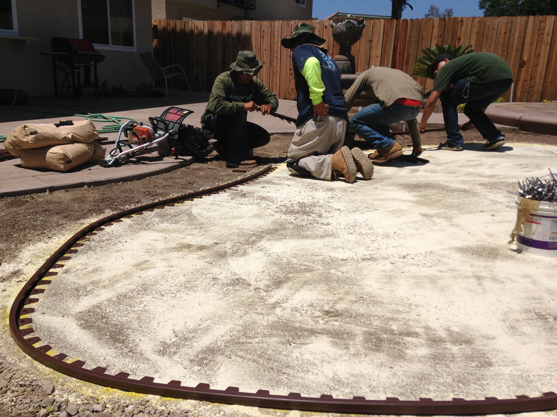 people preparing site for a DIY putting green
