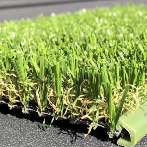 green colored putting green perimeter cutaway with artificial turf swatch