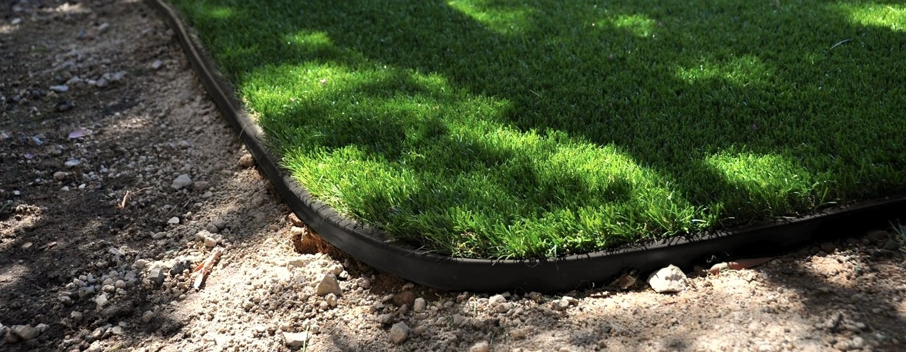 black artificial lawn border and artificial turf