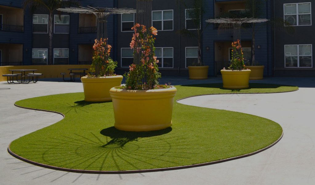 synthetic grass edging creates a line between turf and other surfaces