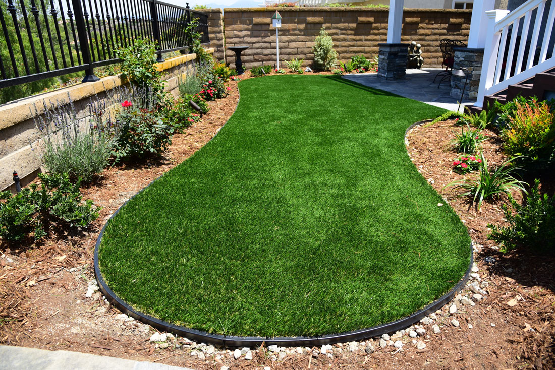synthetic turf supplies outline pet lawn at bottom of white staircase